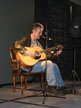 Anthony Head with guitar