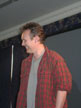 Anthony Head on stage (red shirt)