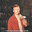 Anthony Head on stage (red chair)
