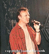 Anthony Head on stage (red chair)