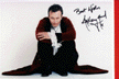 In red coat, crouching